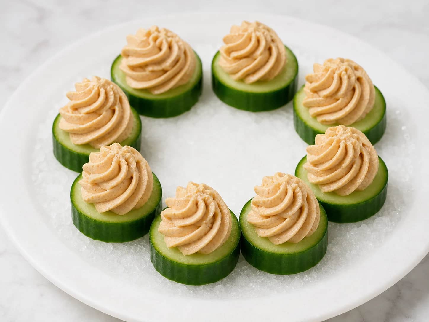 Chicken pate rosettes on peeled cucumber rounds