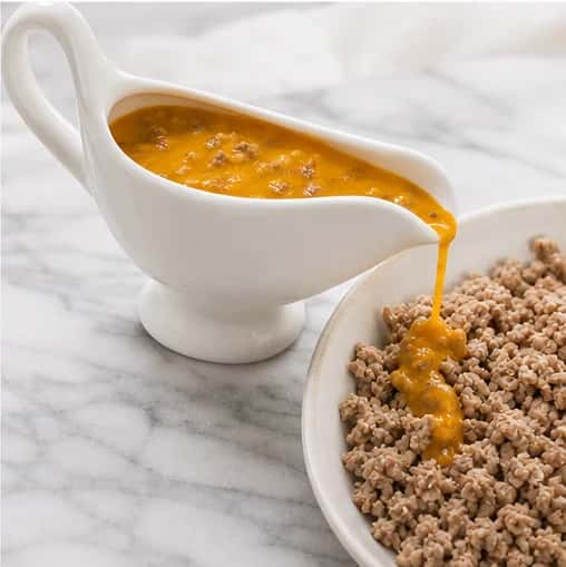 Step 5: Cool completely, stir in the reserved crumbles, and measure one portion over the dog's regular complete food.