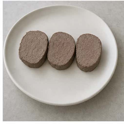 Step 4: Rest the venison for 5 minutes, then slice it across the grain into three thin medallions. Check the cut faces for an evenly cooked center and remove any remaining tough tissue.
